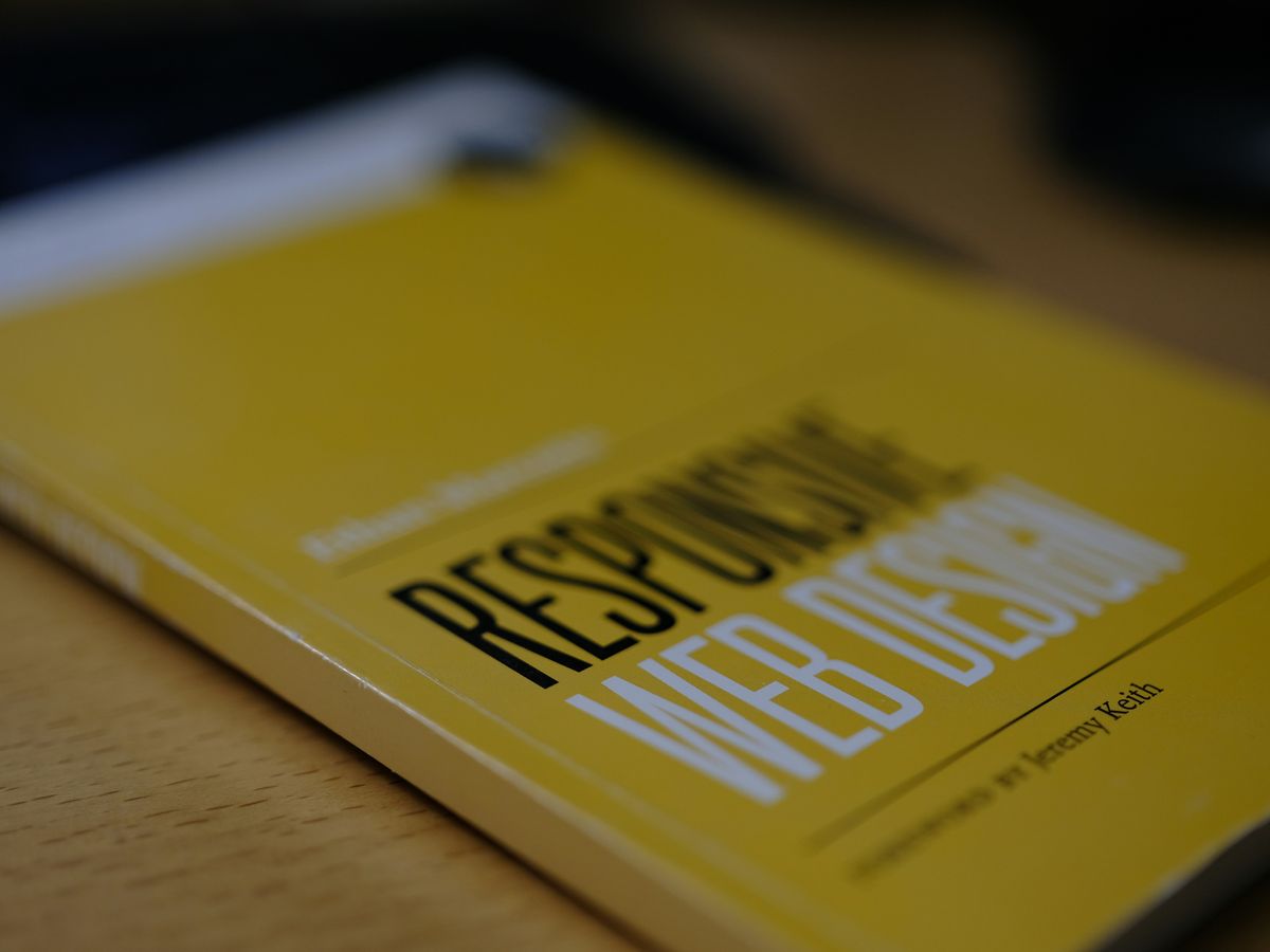 a yellow book sitting on top of a wooden table